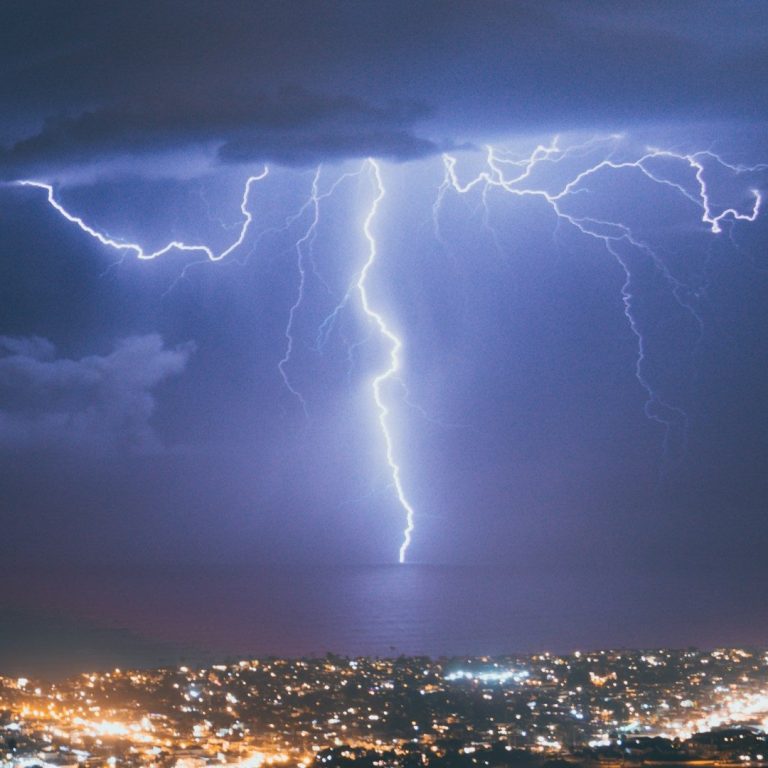 Lightning over the city symbolising idioms for rare and unusual events