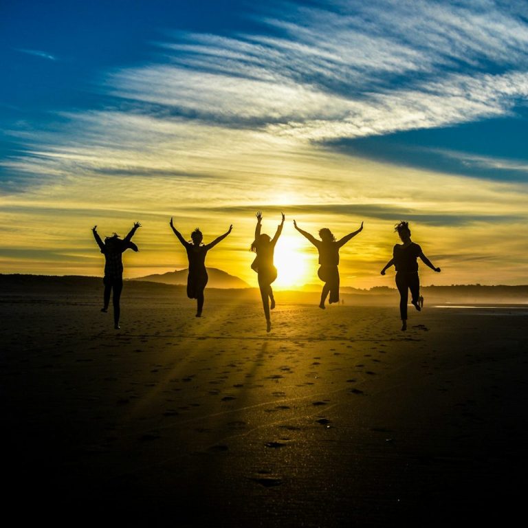 People jump of joy symbolizing achievement and success idioms