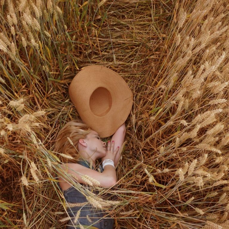 A lady is having a nap in the hay-and illustration to sleep and rest idioms